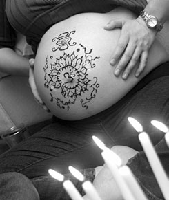 pregnant henna decorated belly