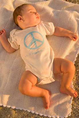 organic cotton onesie with peace logo