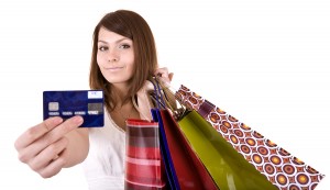 bigstock-Girl-with-bag-and-credit-card--21173042